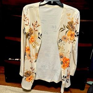 Lightweight, long-sleeved cream cardigan with peach/tan/brown flowers